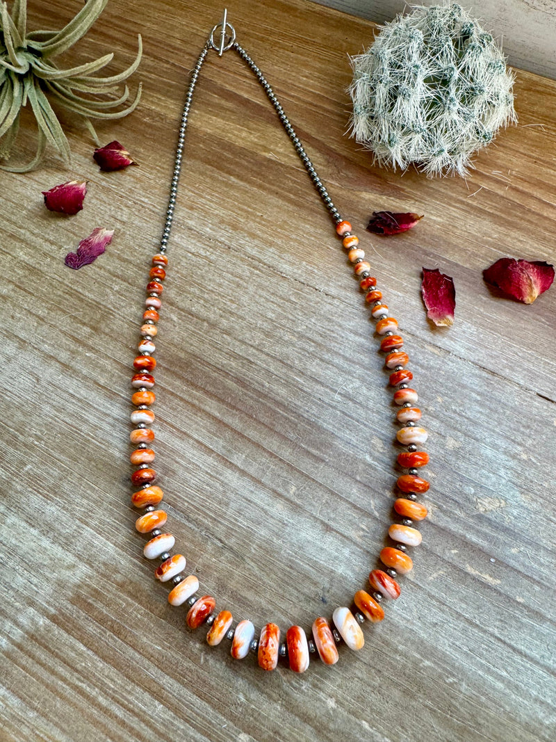 22 Inch orange spiny and sterling silver pearls