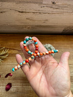 Orange and turquoise magnesite bead hair clips