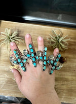 Blue cactus with flower with turquoise rings